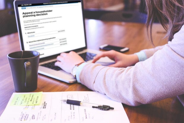 Woman testing a website on a laptop