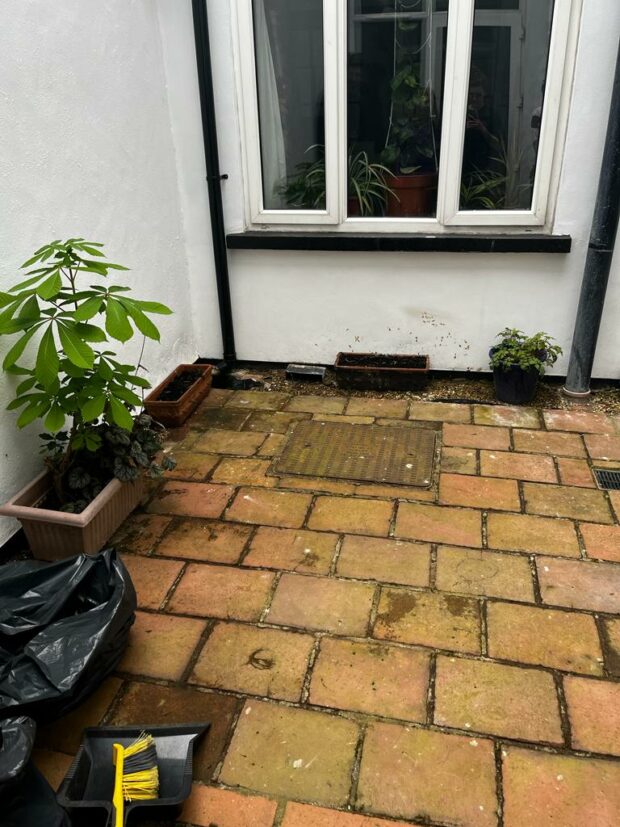 The Courtyard after, weeds removed and tiles cleaned
